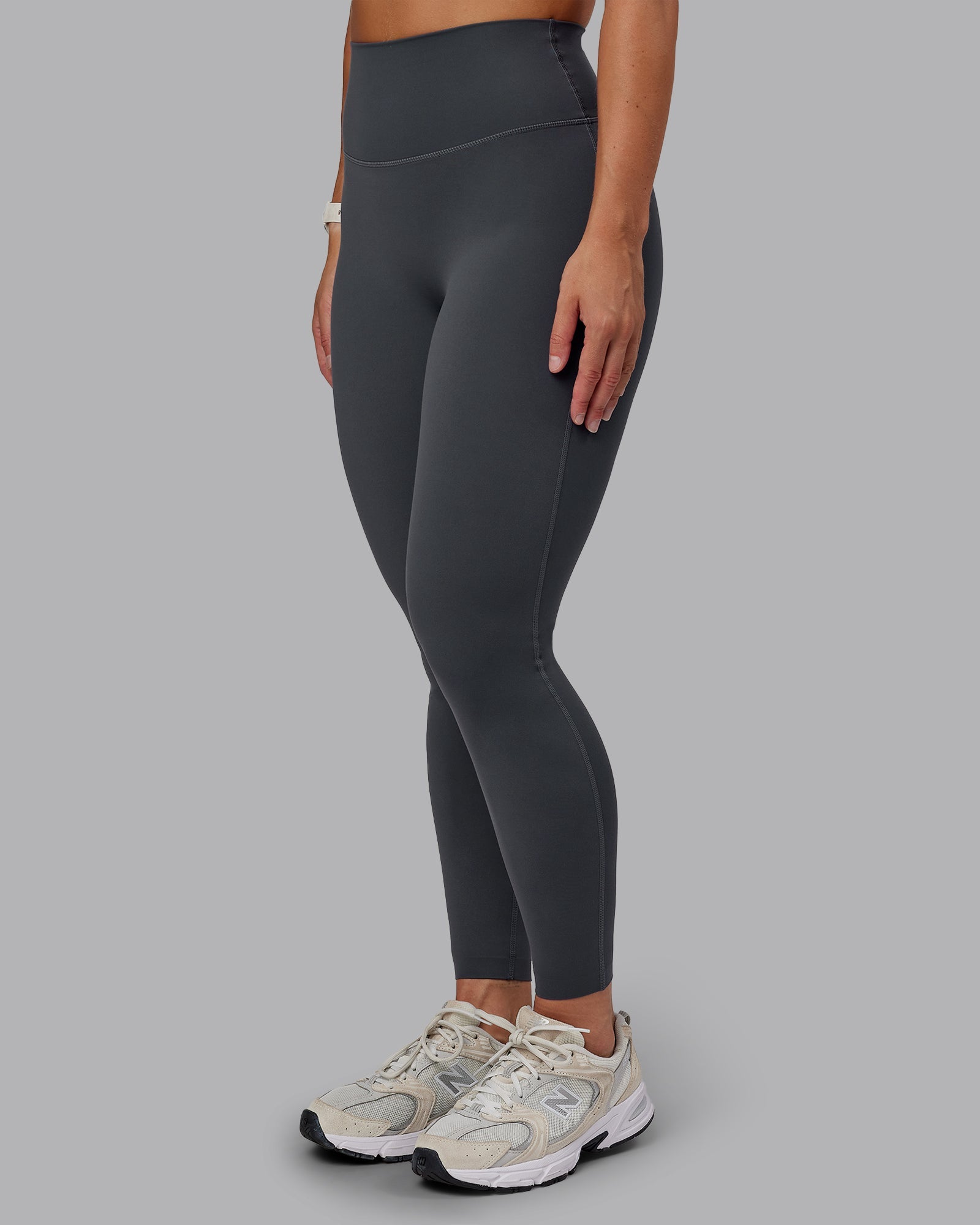 Woman wearing Elixir Ultra High-Rise Full Length Leggings in Dark Storm | Size:S