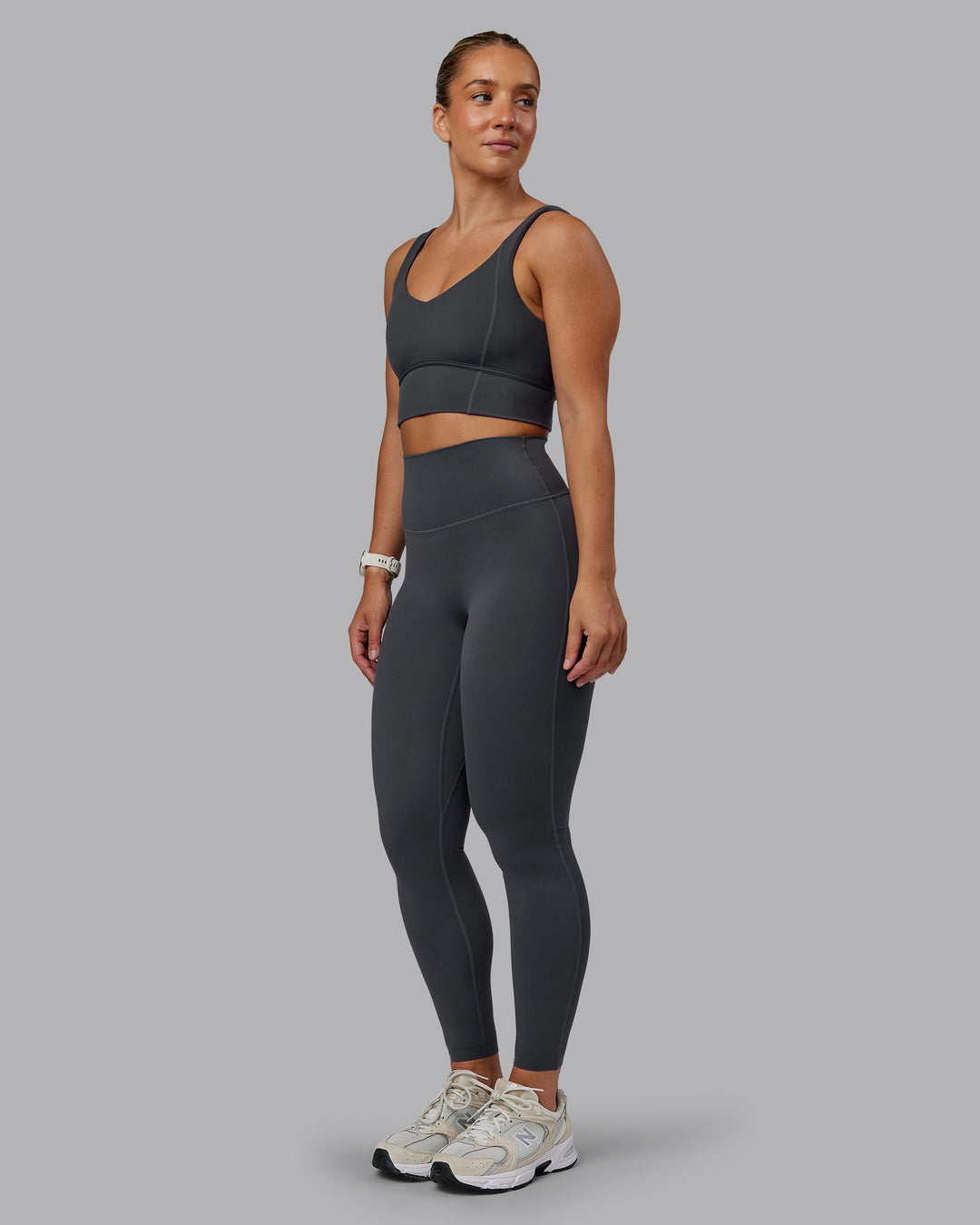 Woman wearing Elixir Ultra High-Rise Full Length Leggings in Dark Storm | Size:S