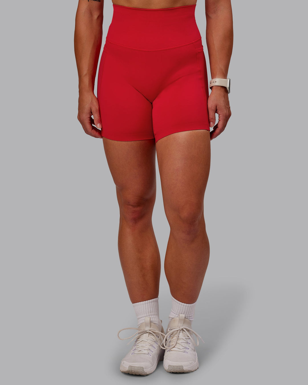 Woman wearing Elixir Ultra High-Rise 6" Short Pockets in Flame | Size:S