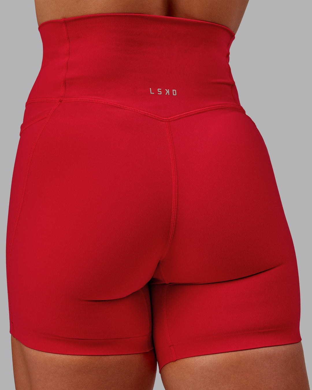 Woman wearing Elixir Ultra High-Rise 6" Short Pockets in Flame | Size:S