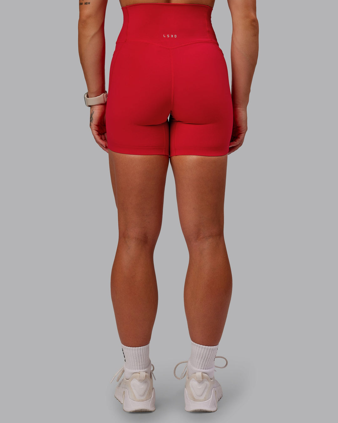 Woman wearing Elixir Ultra High-Rise 6" Short Pockets in Flame | Size:S
