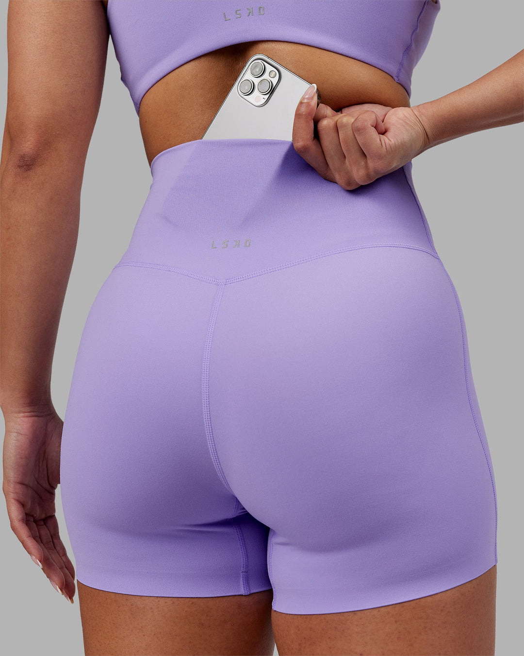 Woman wearing Elixir Ultra High-Rise 4" Short - Violet Ray | Model:Ayla | Size:S