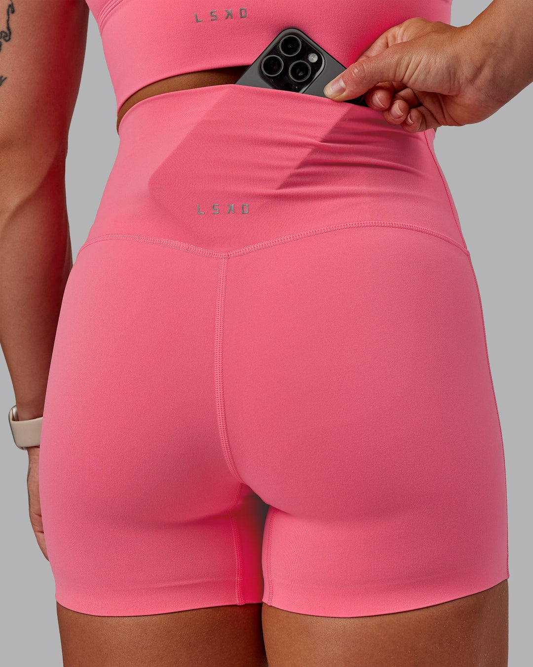 Woman wearing Elixir Ultra High-Rise 4" Short in Pink Lemonade | Size:S