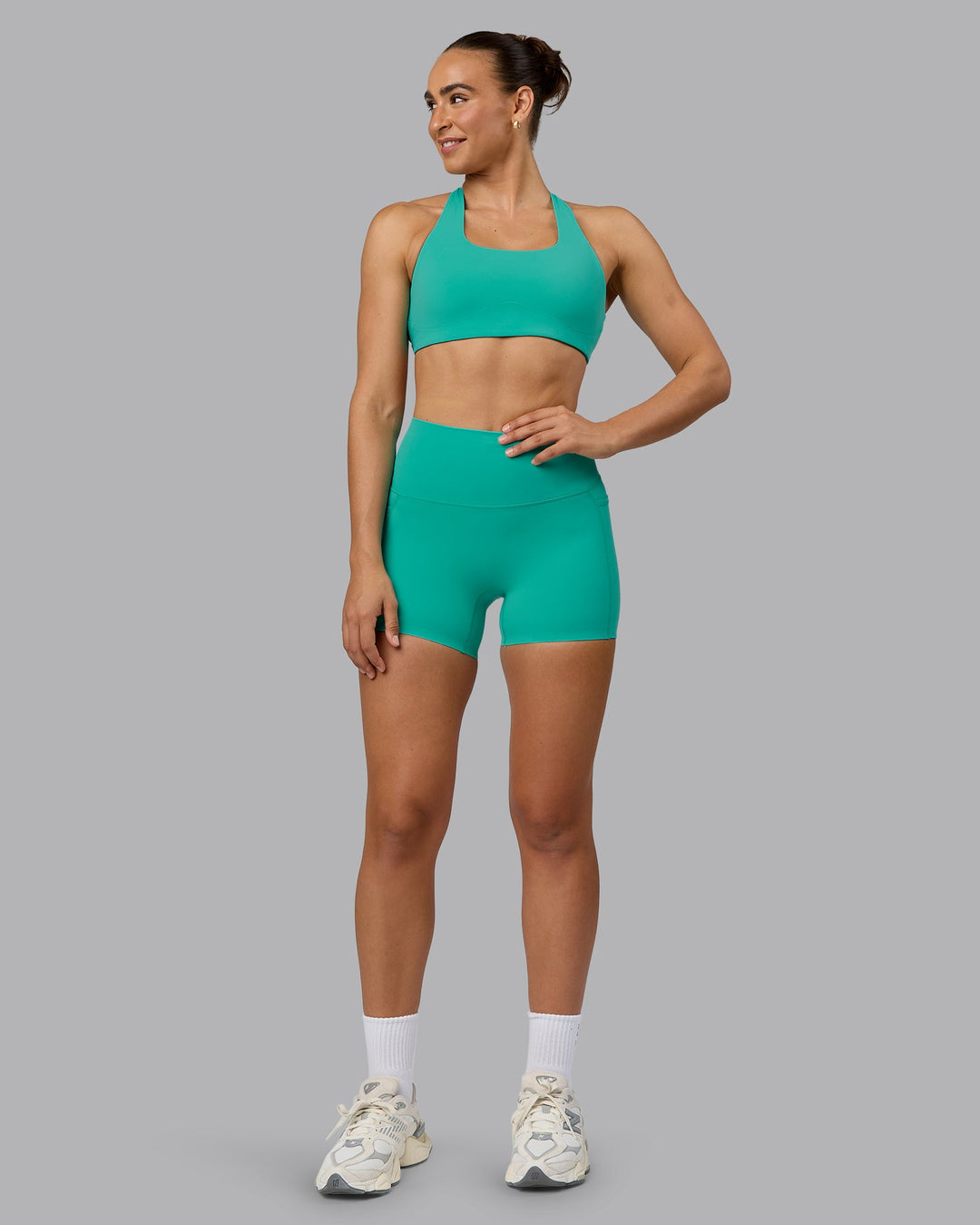 Woman wearing Elixir Ultra High-Rise 4" Short Pockets - Atlantis