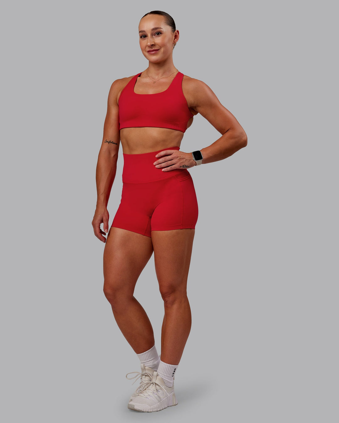 Woman wearing Elixir Ultra High-Rise 4" Short Pockets in Flame | Size:S