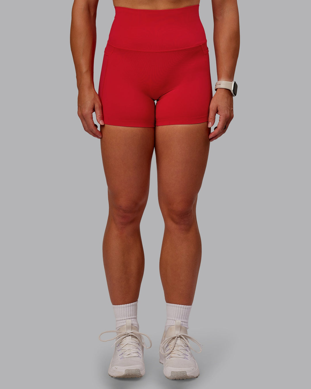 Woman wearing Elixir Ultra High-Rise 4" Short Pockets in Flame | Size:S