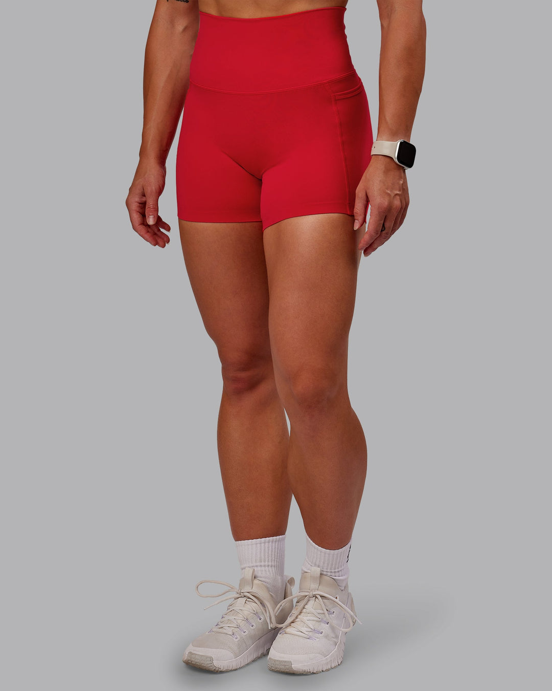 Woman wearing Elixir Ultra High-Rise 4" Short Pockets in Flame | Size:S