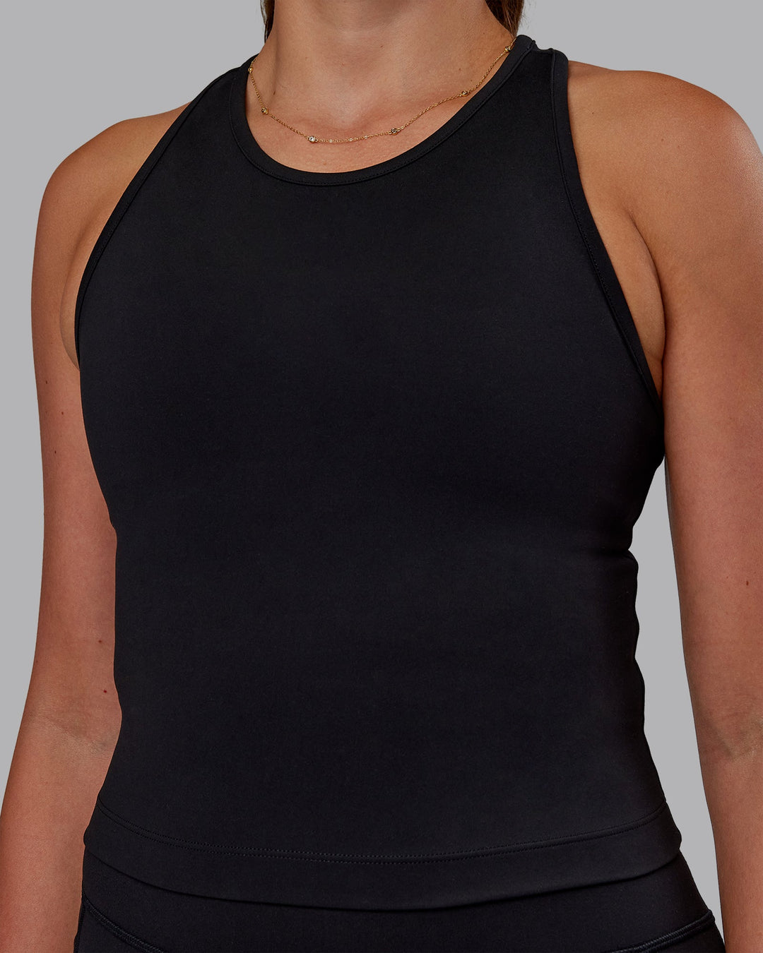 Woman wearing Flow Performance Tank - Black | Model:Phoebe | Size:S