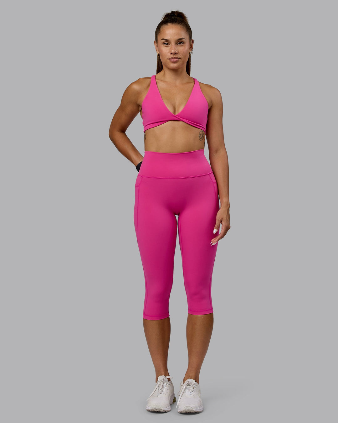 Woman wearing Fusion Ultra High-Rise 3/4 Legging Pockets - Fuchsia Pink | Model:Vanessa | Size:S