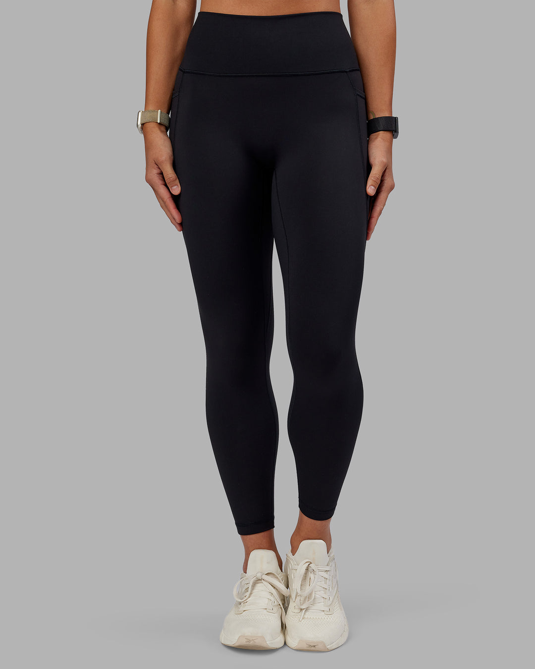 Woman wearing Fusion Ultra High-Rise 7/8 Legging Pockets - Black | Model:Vanessa | Size:S