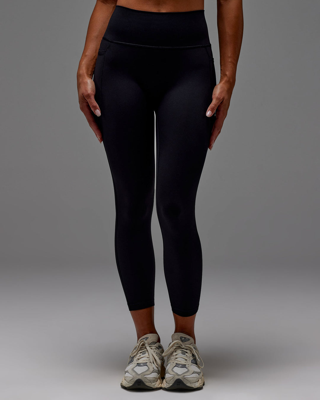 Woman wearing Fusion Ultra High-Rise 7/8 Legging Pockets - Black | Model:Demi | Size:S