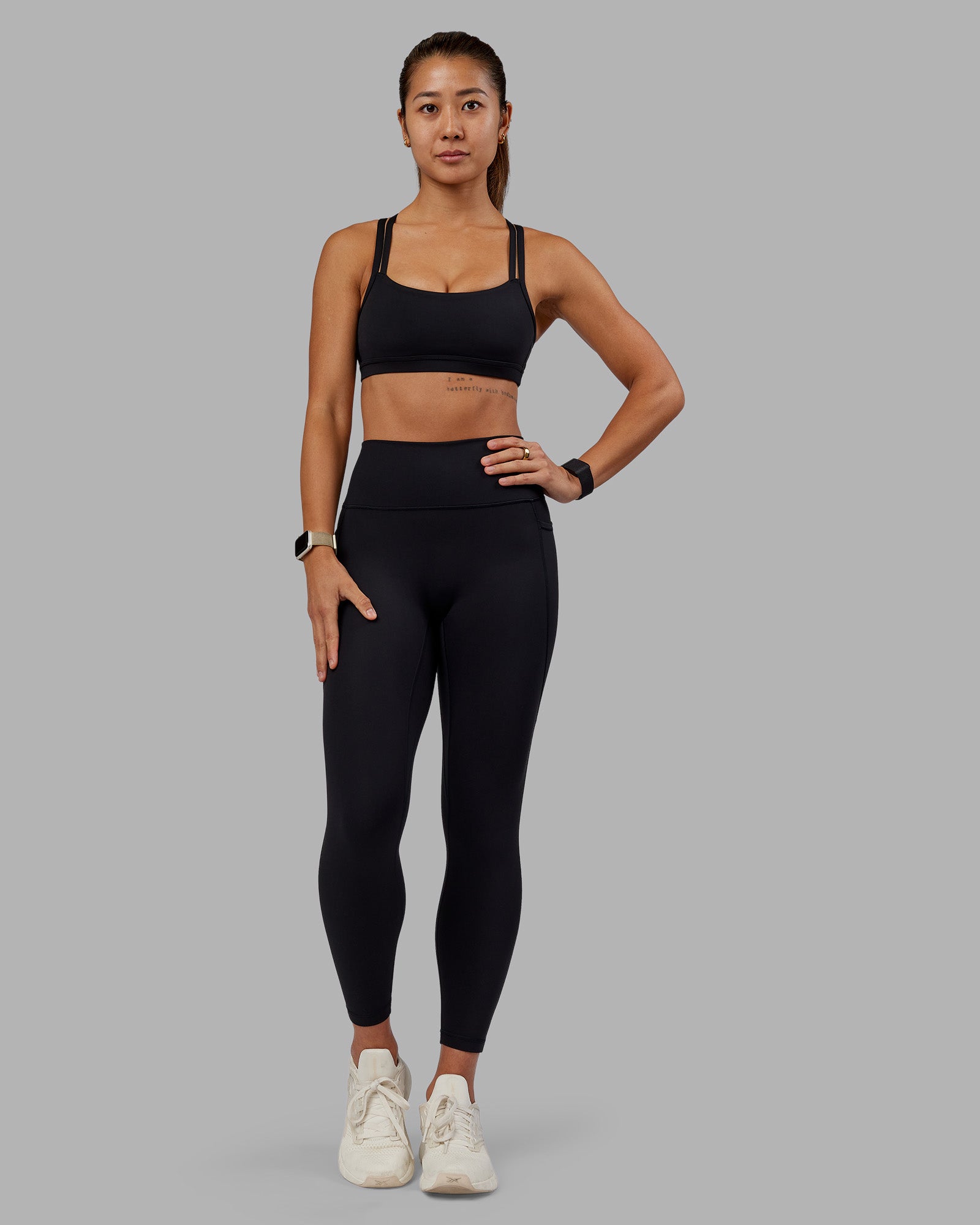 Woman wearing Fusion Ultra High-Rise 7/8 Legging Pockets - Black | Model:Vanessa | Size:S