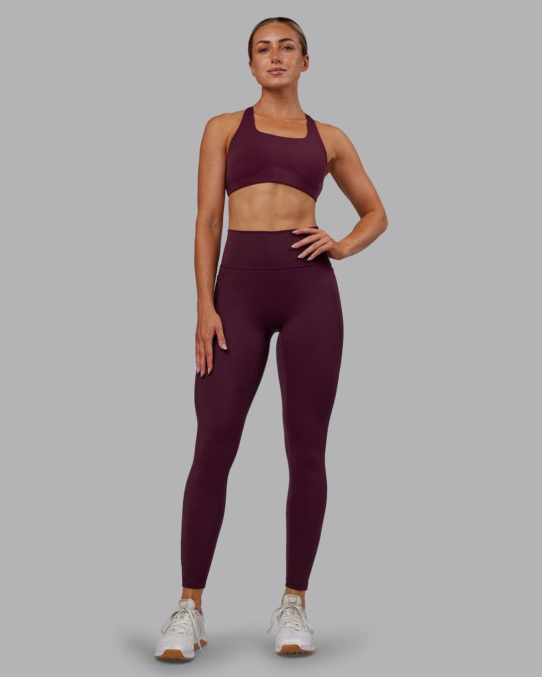 Woman wearing Fusion Ultra High-Rise Full Length Legging Pockets - Cherry Lacquer | Model:Paris | Size:S