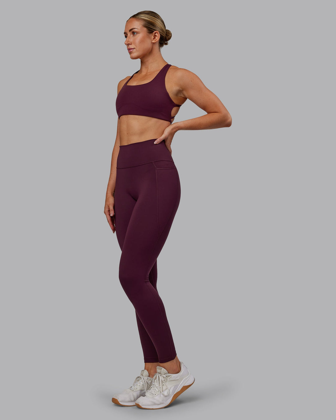 Woman wearing Fusion Ultra High-Rise Full Length Legging Pockets - Cherry Lacquer | Model:Paris | Size:S