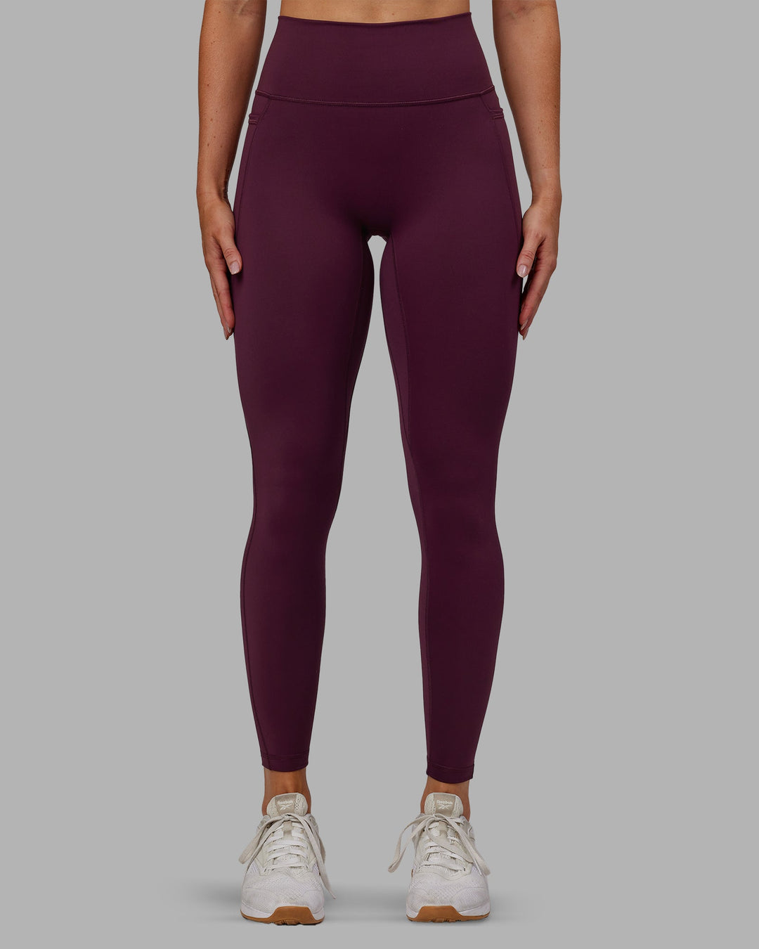 Woman wearing Fusion Ultra High-Rise Full Length Legging Pockets - Cherry Lacquer | Model:Paris | Size:S
