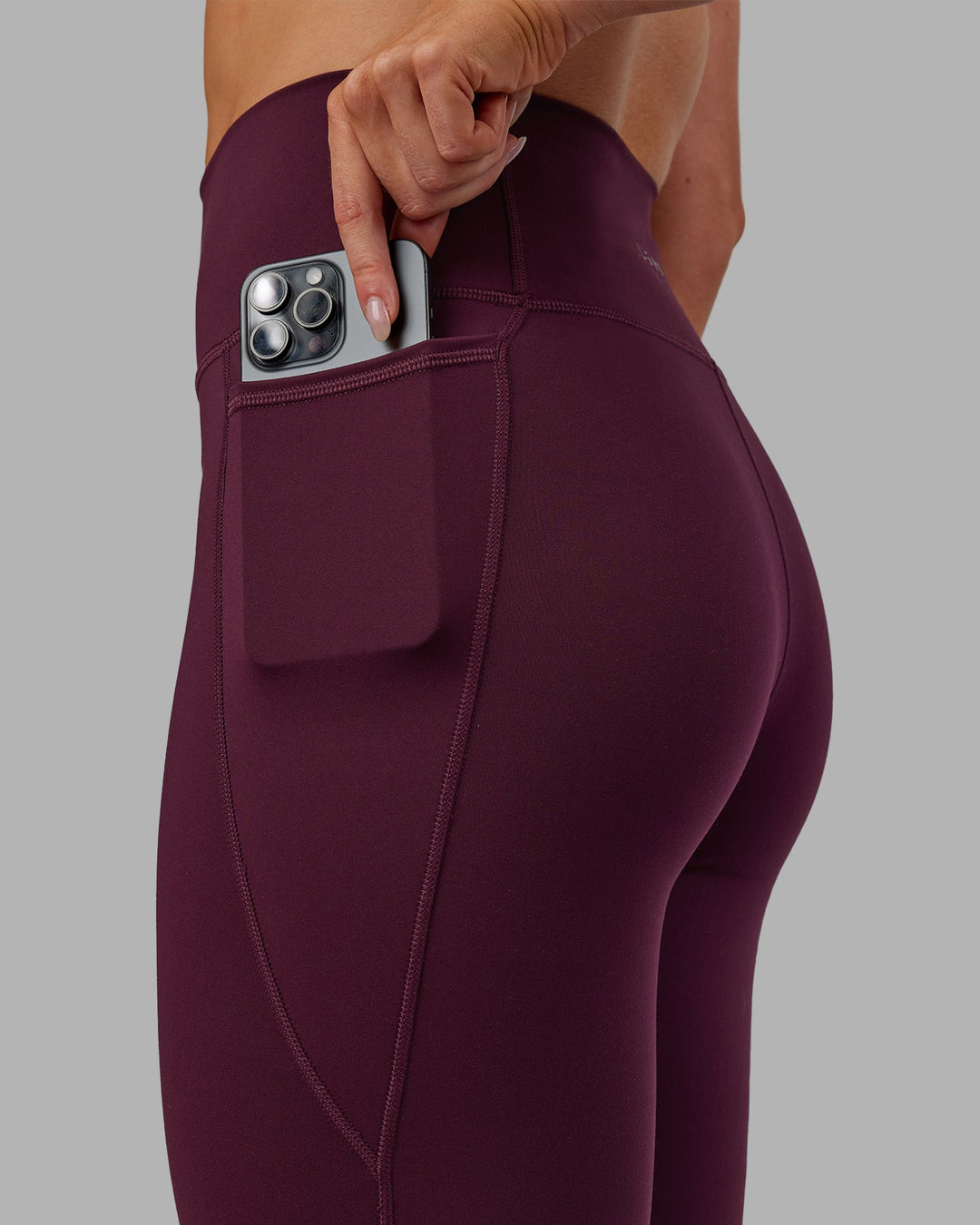 Woman wearing Fusion Ultra High-Rise Full Length Legging Pockets - Cherry Lacquer | Model:Paris | Size:S