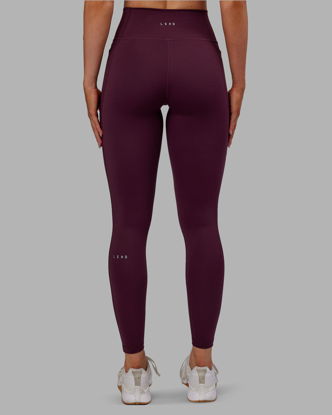 Woman wearing Fusion Ultra High-Rise Full Length Legging Pockets - Cherry Lacquer | Model:Paris | Size:S
