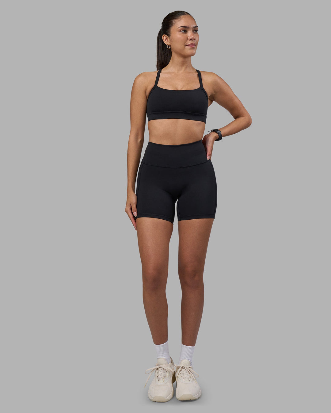 Woman wearing Fusion High-Rise 6" Short Pockets - Black | Model:Rhiley | Size:S