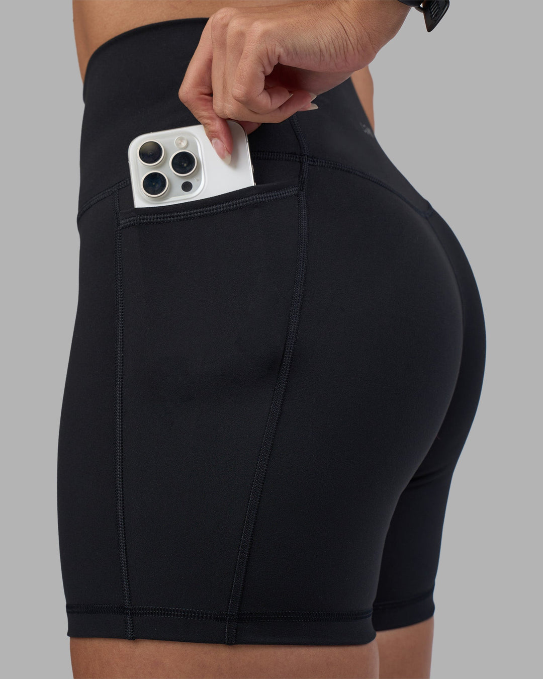 Woman wearing Fusion High-Rise 6" Short Pockets - Black | Model:Rhiley | Size:S