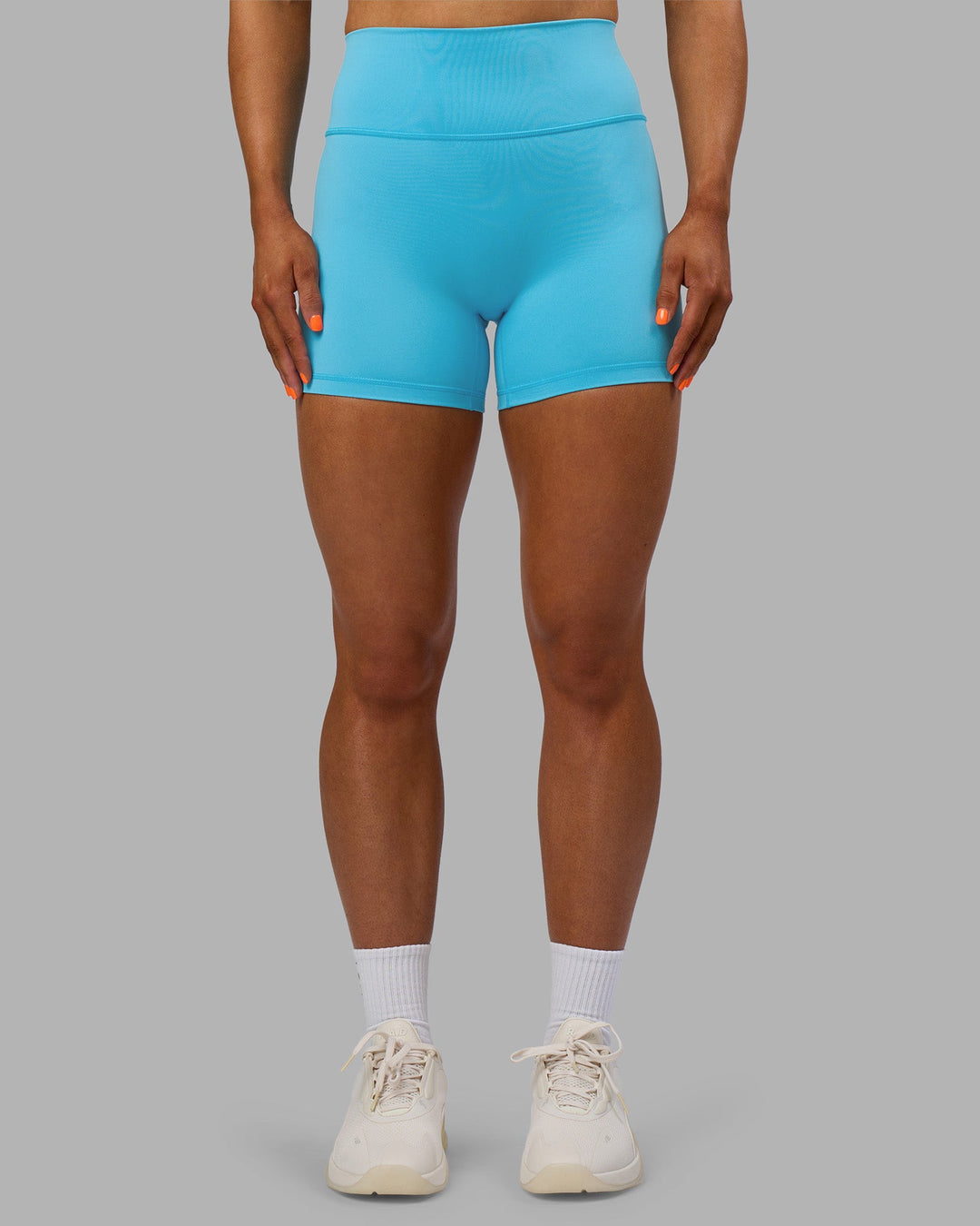 Woman wearing Fusion Ultra High-Rise 4" Short - Blue Atoll | Model:Georgia | Size:S