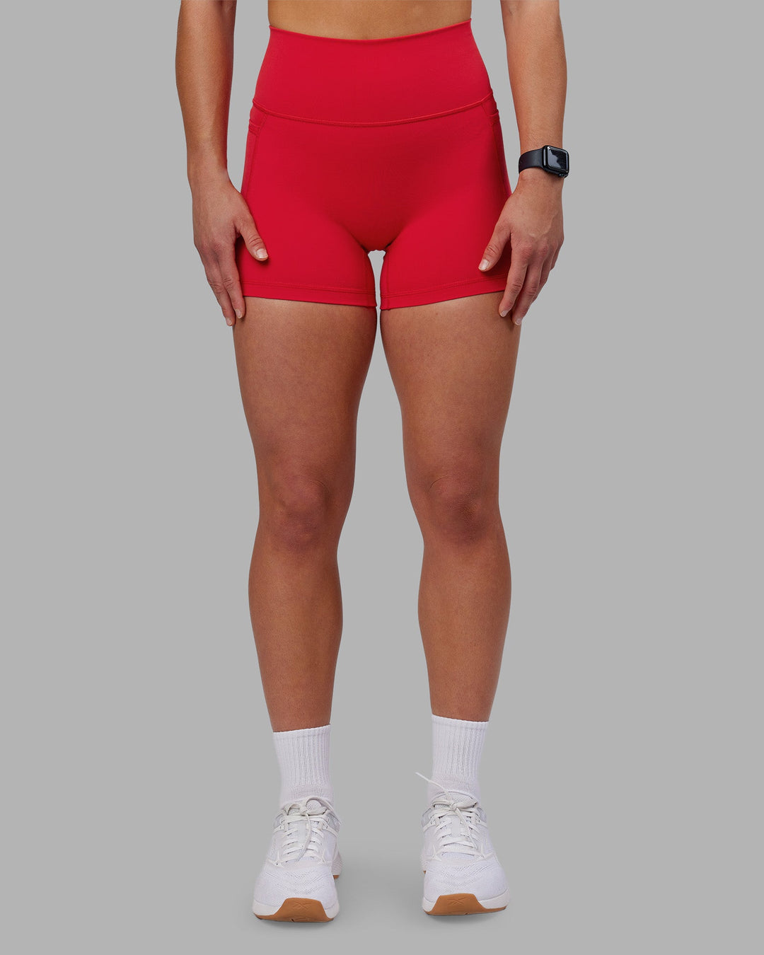 Woman wearing Fusion Ultra High-Rise 4" Short Pockets - Scarlet | Model:Keisha | Size:S