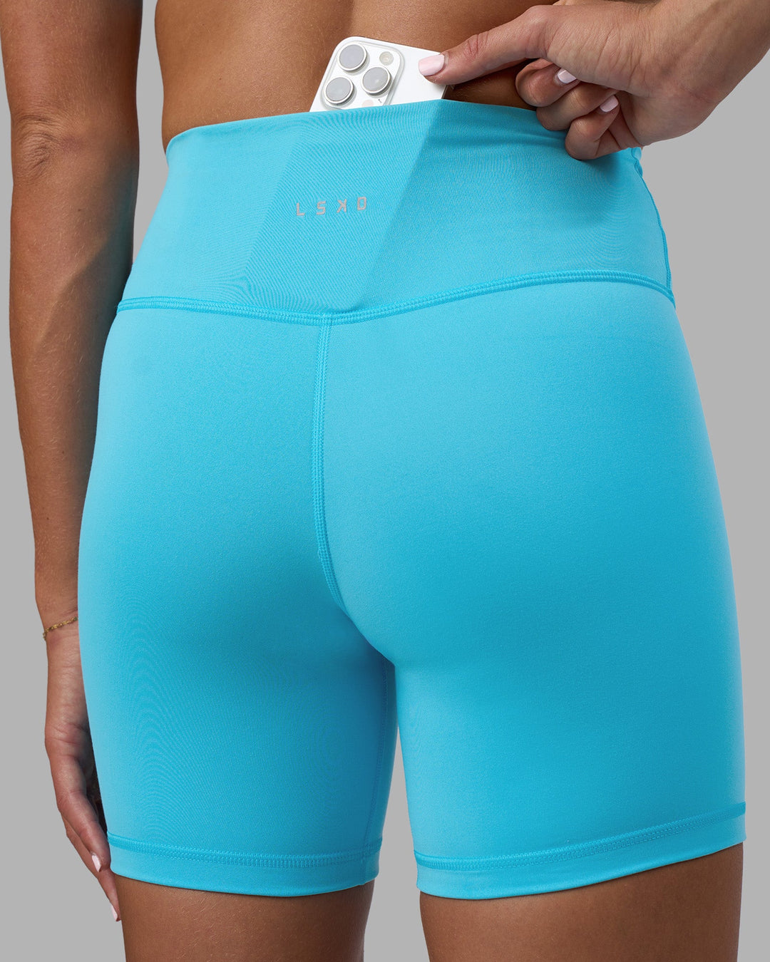 Woman wearing Fusion Ultra High-Rise 6" Short - Blue Atoll | Model:Katie | Size:S