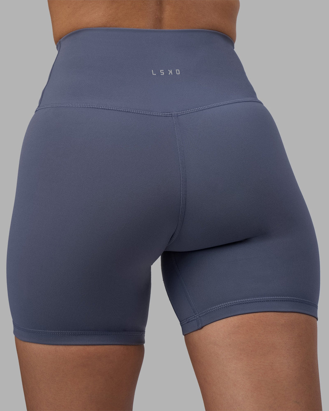 Woman wearing Fusion Ultra High-Rise 6" Short - Night Shadow | Model:Rhiley | Size:S