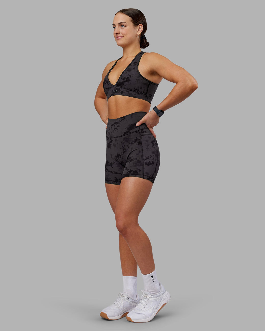 Woman wearing Fusion Ultra High-Rise 6" Short Pockets - Black Tie Dye | Model:Keisha | Size:S