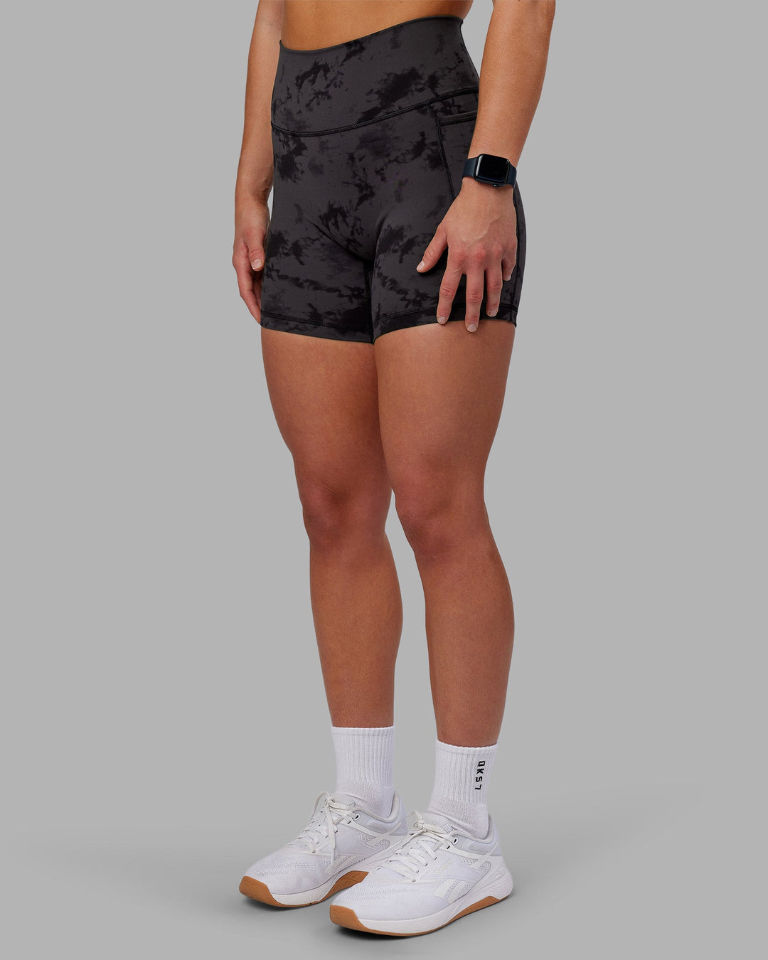 Woman wearing Fusion Ultra High-Rise 6" Short Pockets - Black Tie Dye | Model:Keisha | Size:S