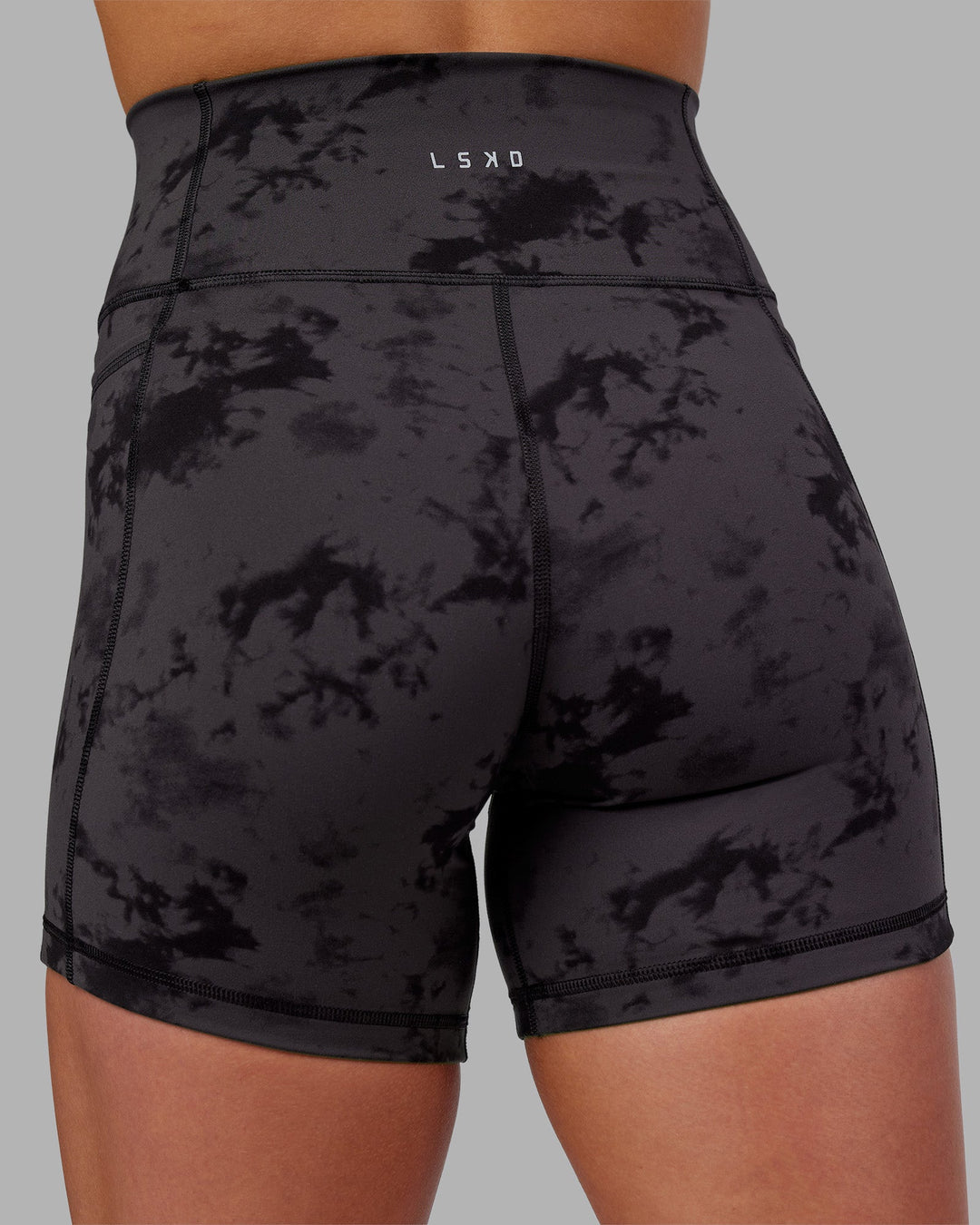 Woman wearing Fusion Ultra High-Rise 6" Short Pockets - Black Tie Dye | Model:Keisha | Size:S
