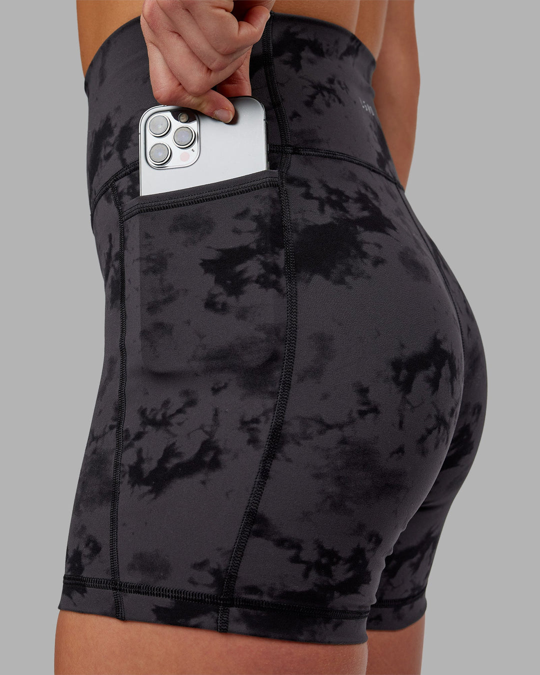 Woman wearing Fusion Ultra High-Rise 6" Short Pockets - Black Tie Dye | Model:Keisha | Size:S