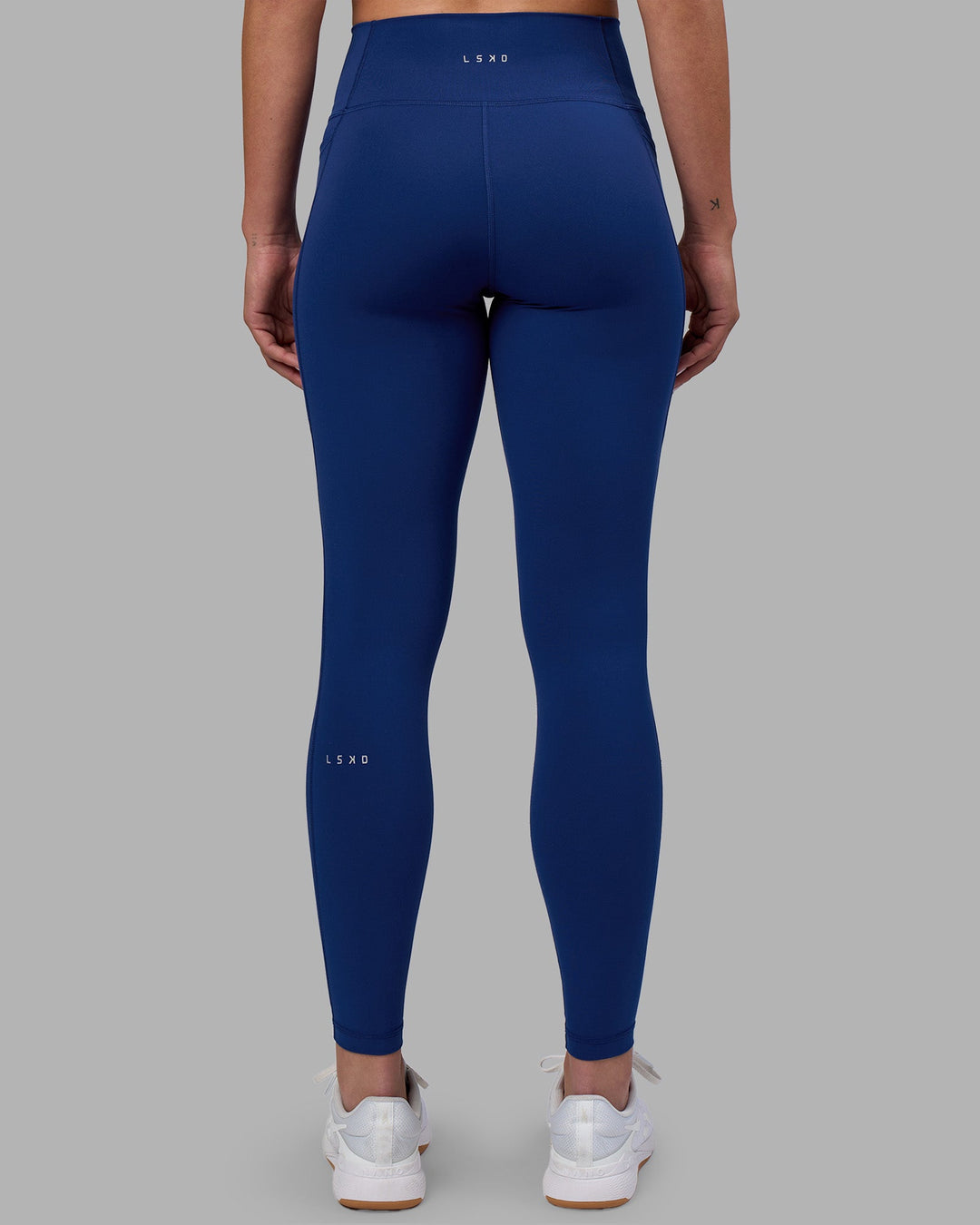 Woman wearing Fusion Ultra High-Rise Full Length Legging Pockets - Midnight Blue | Model:Charlize | Size:S