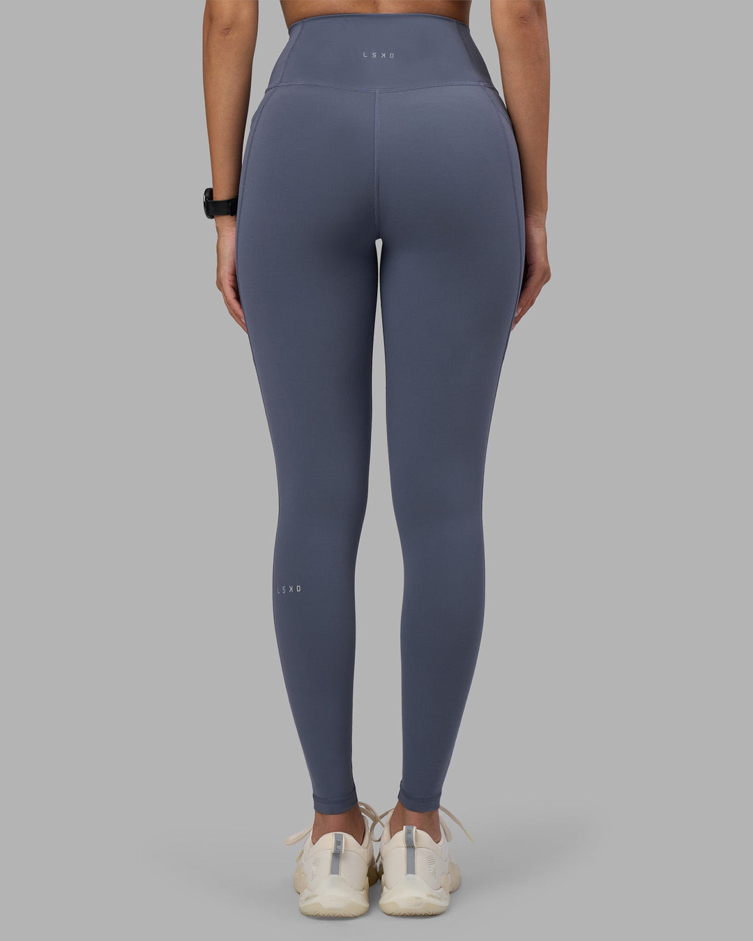 Woman wearing Fusion Ultra High-Rise Full Length Legging Pockets - Night Shadow | Model:Rhiley | Size:S