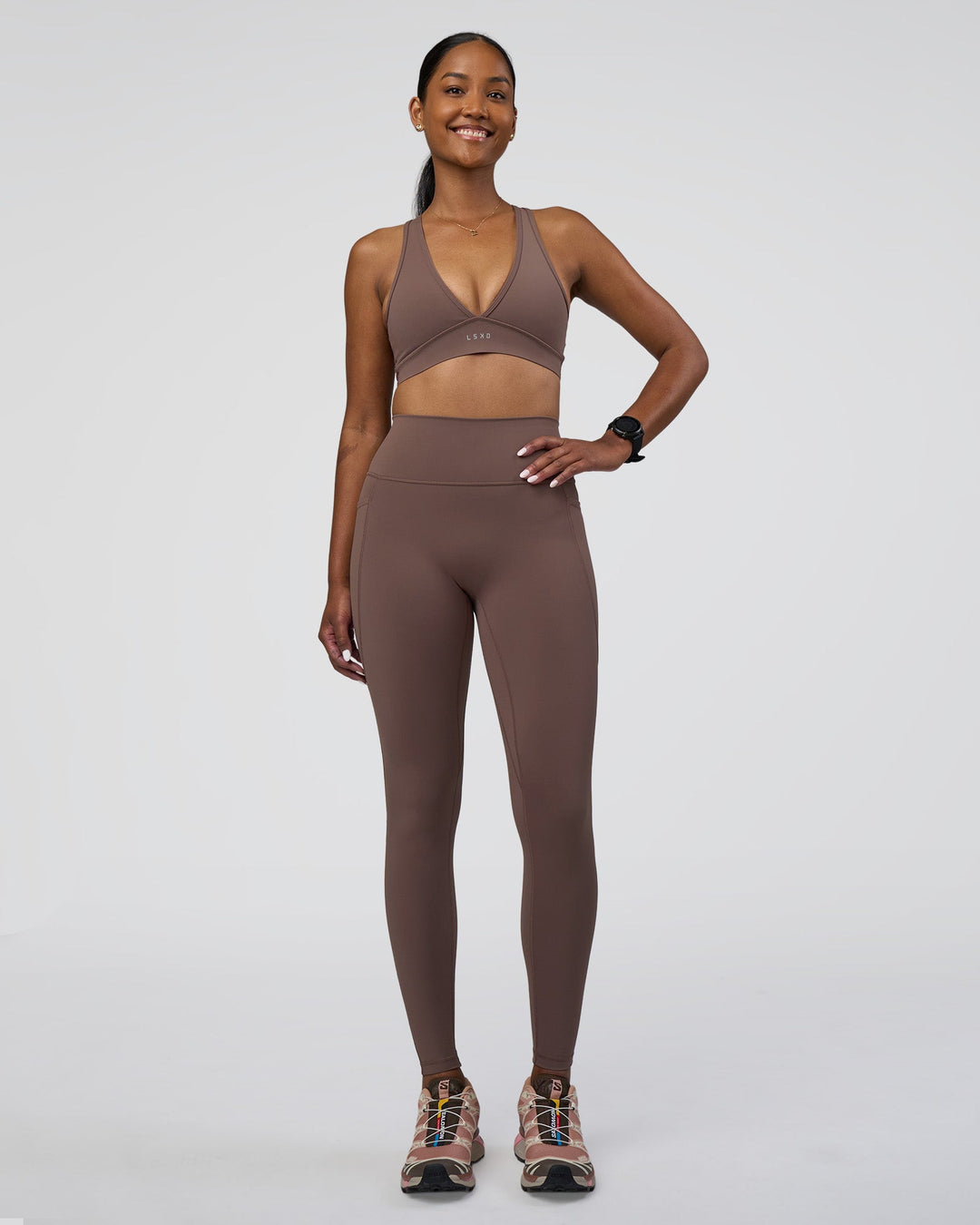 Woman wearing Fusion Ultra High-Rise Full Length Legging Pockets - Peppercorn | Model:Rica | Size:S