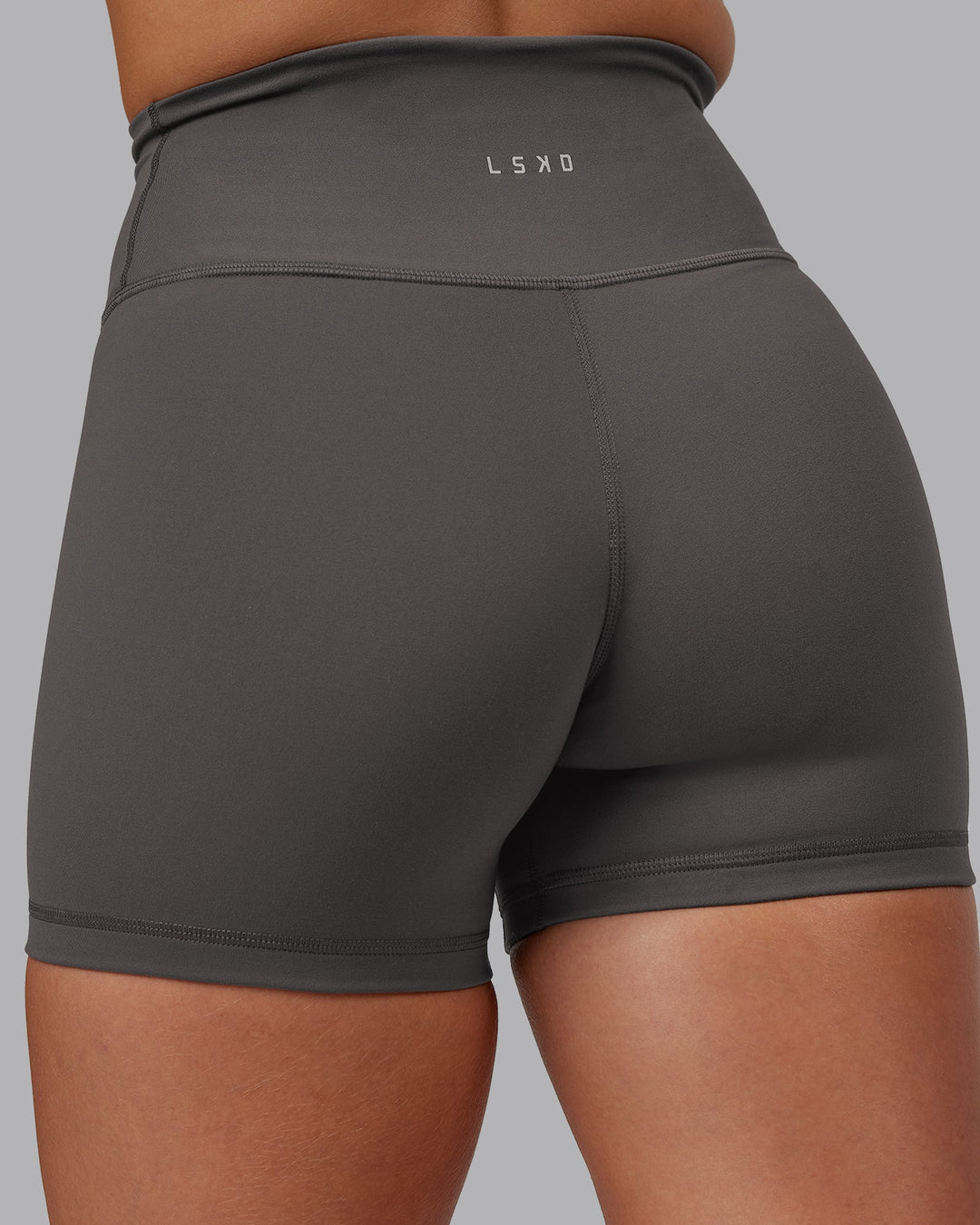 Woman wearing Fusion Ultra High-Rise 4" Short - Dark Storm | Model:Hannah | Size:S