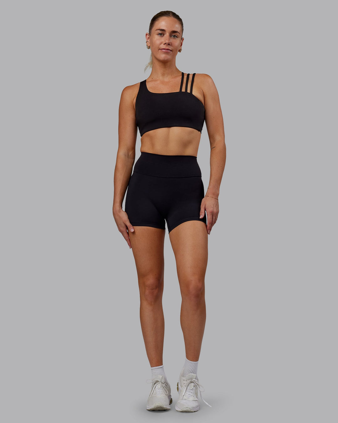 Woman wearing Fusion Ultra High-Rise 4" Short - Black | Model:Hannah | Size:S