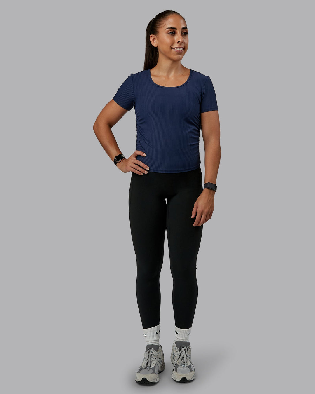 Woman wearing Ignite Ribbed Scrunch Side Cropped Tee - Future Navy | Size:S | Model:Tylah