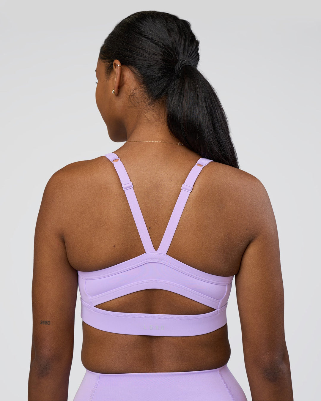 Woman wearing Momentum Sports Bra - Pale Lilac | Model:Rica | Size:S