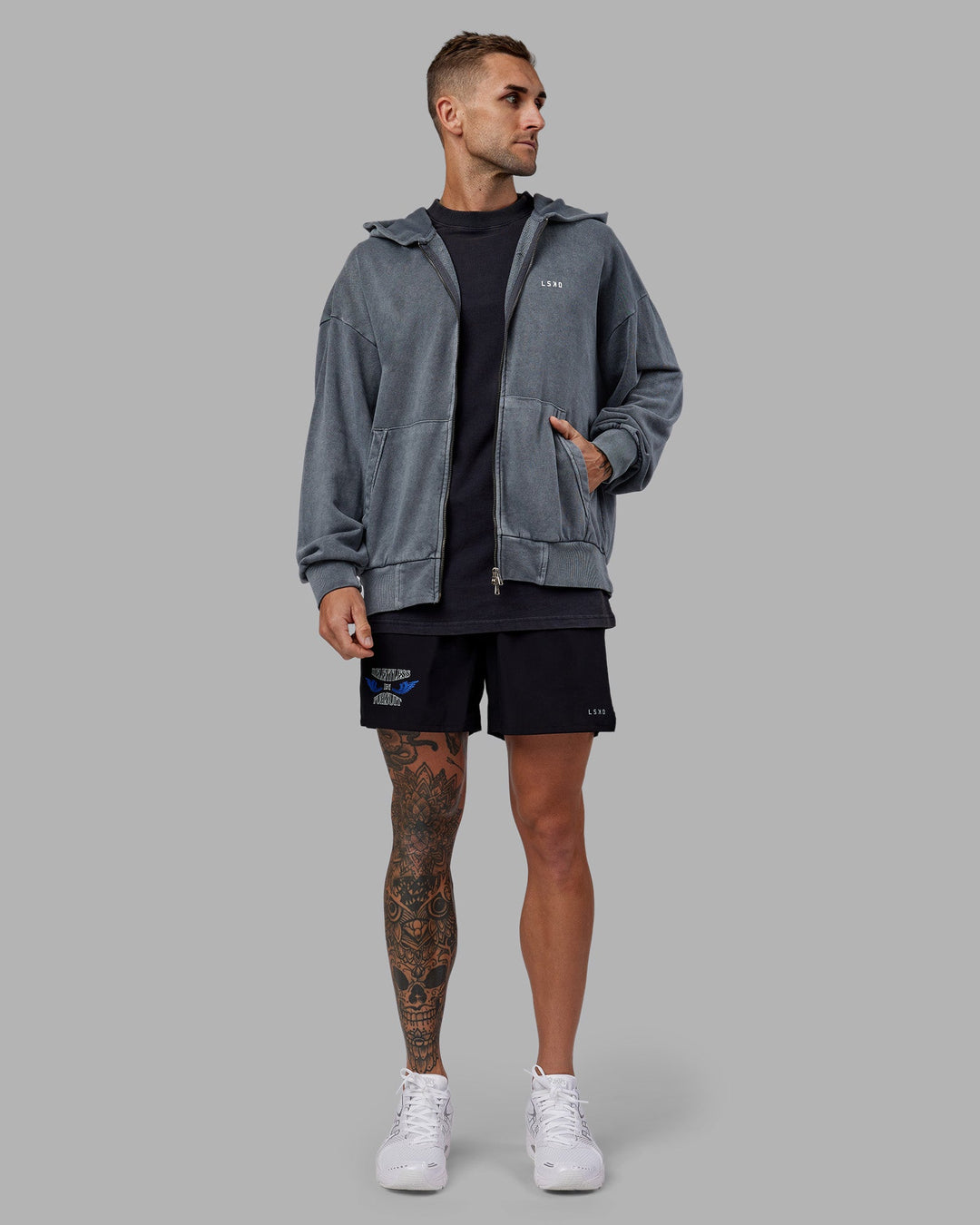 Man wearing Relentless Washed Zip Through Oversized Hoodie - Dark Storm-White | Model:Tommy | Size:S