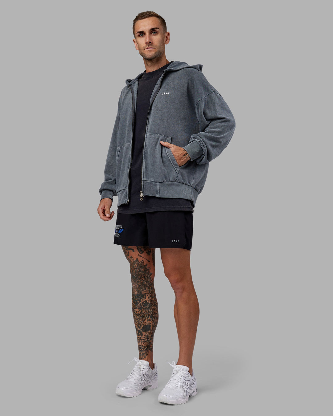 Man wearing Relentless Washed Zip Through Oversized Hoodie - Dark Storm-White | Model:Tommy | Size:S