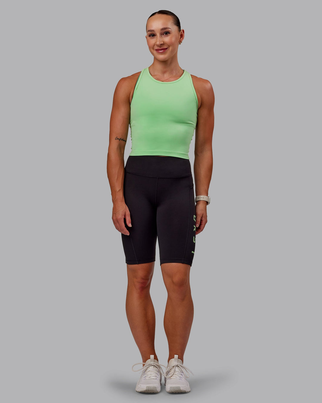 Woman wearing Rep Ultra High-Rise 9" Short Pockets - Black-Surreal Green