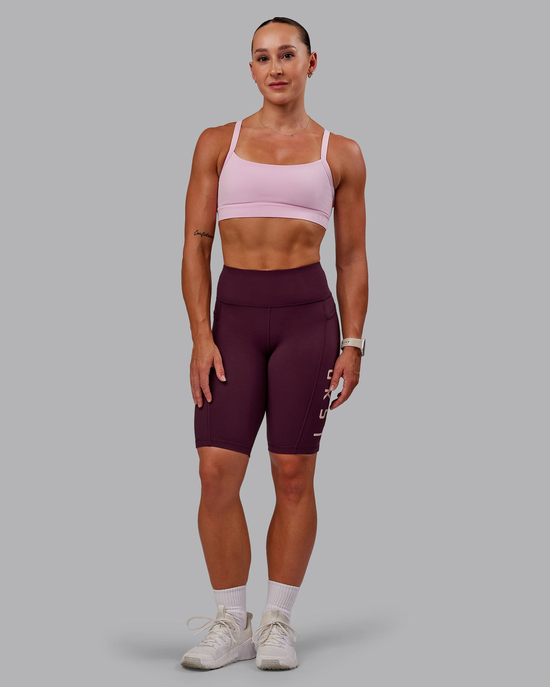 Woman wearing Rep Ultra High-Rise 9" Short Pockets - Cherry Lacquer-Marshmallow