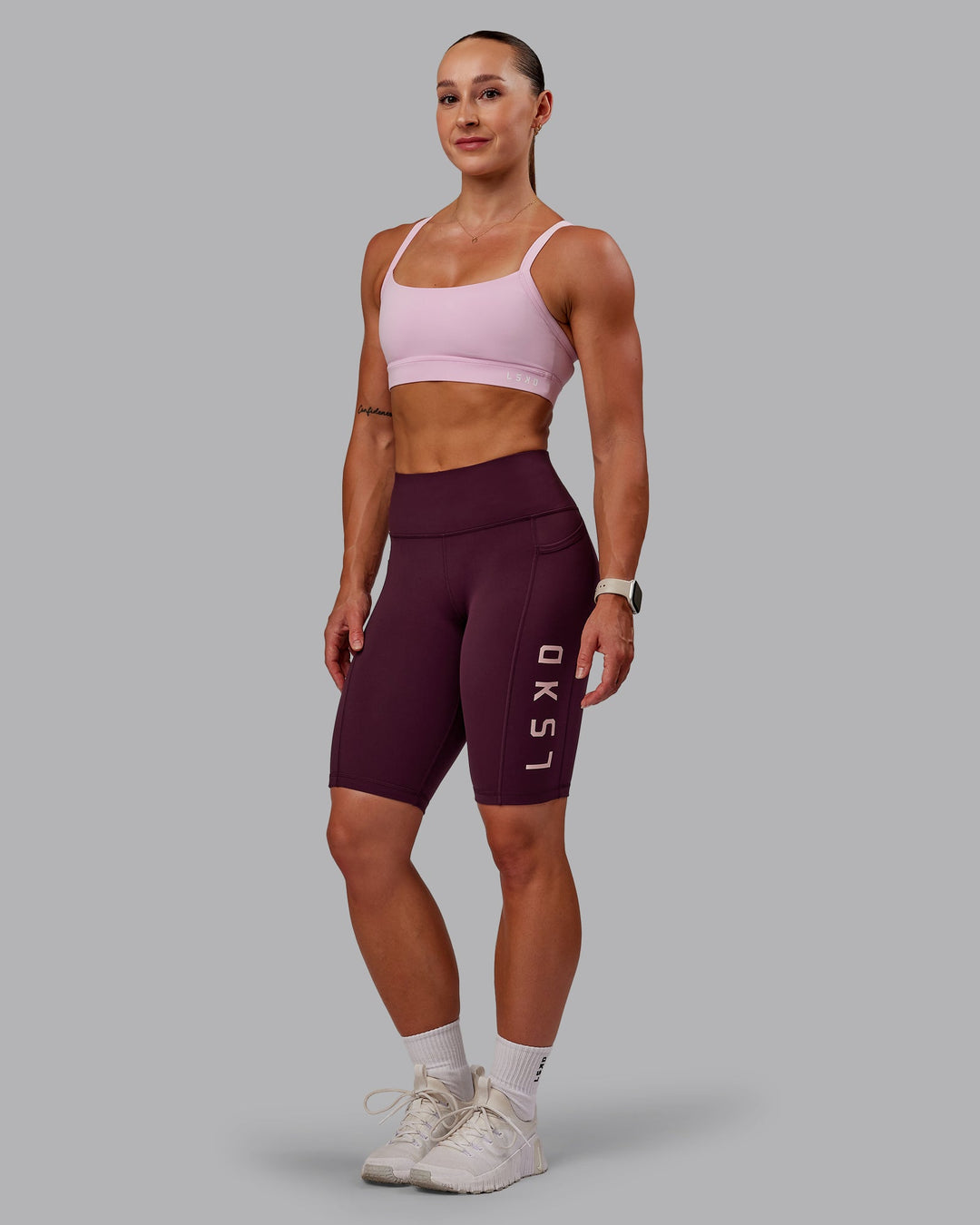 Woman wearing Rep Ultra High-Rise 9" Short Pockets - Cherry Lacquer-Marshmallow