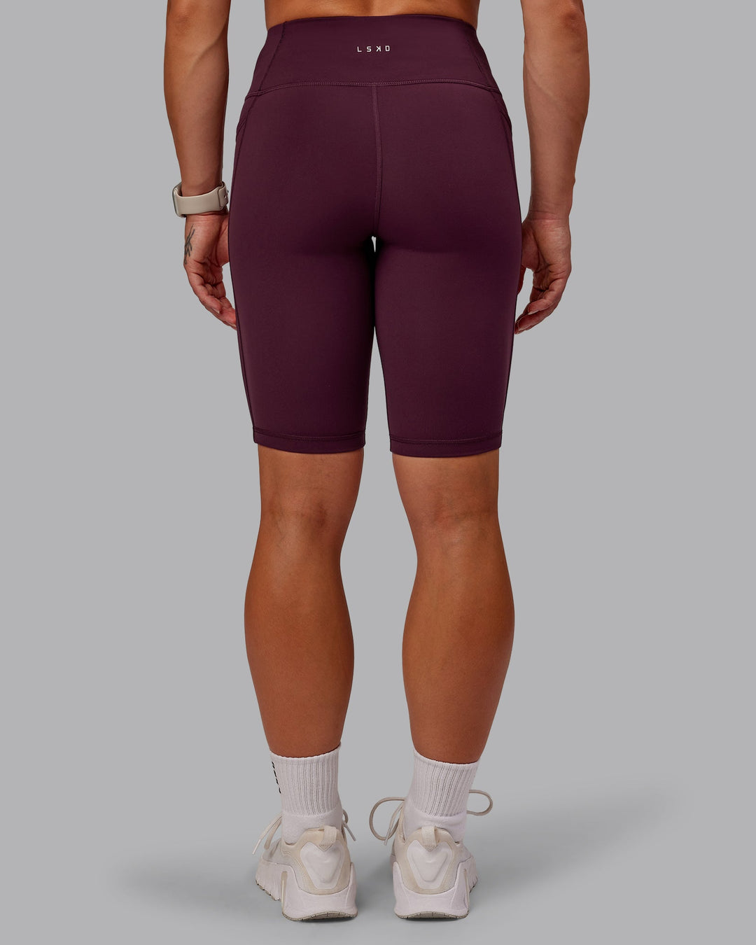 Woman wearing Rep Ultra High-Rise 9" Short Pockets - Cherry Lacquer-Marshmallow