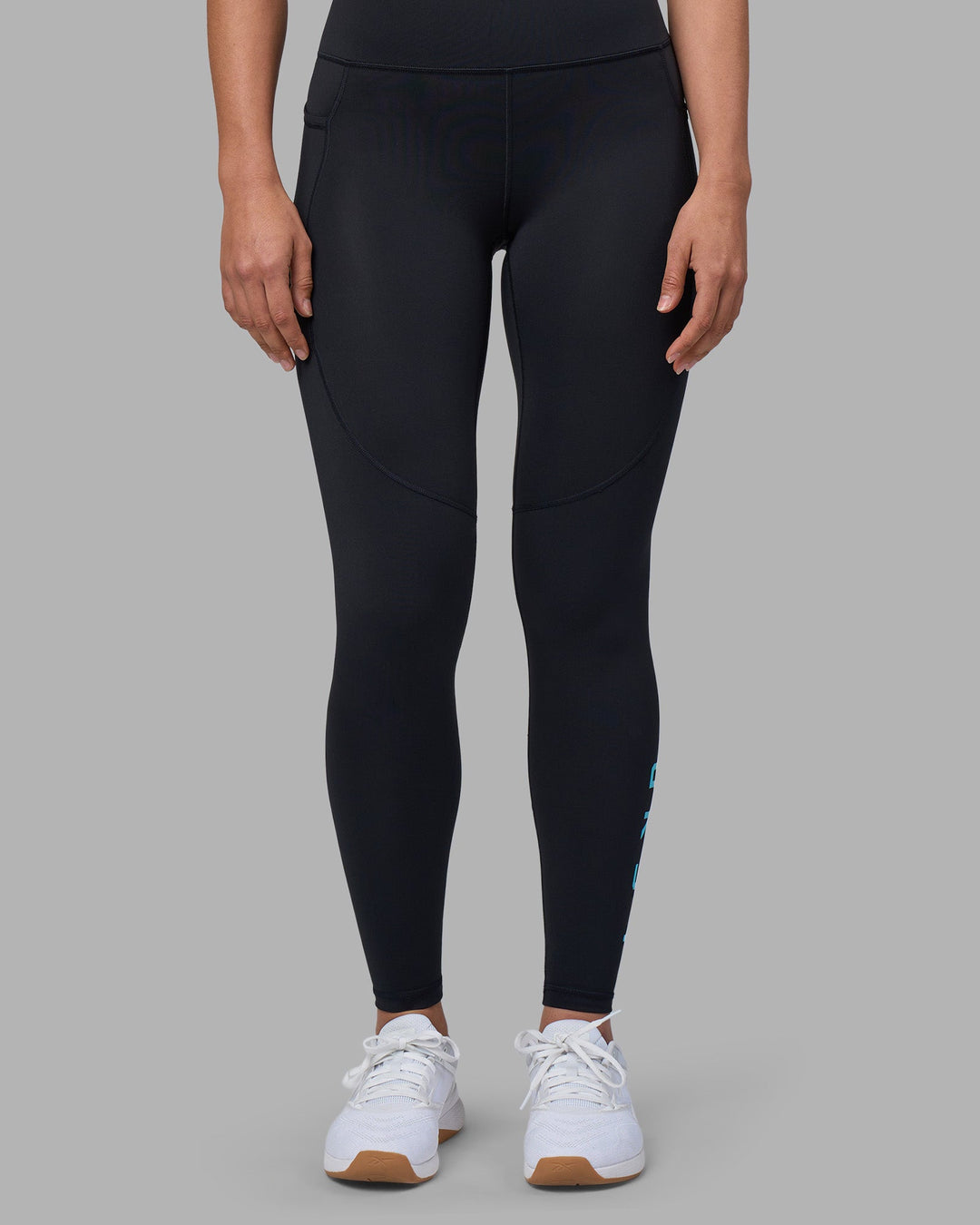 Woman wearing Rep Ultra High-Rise Full Length Legging Pockets - Black-Blue Atoll | Model:Sophie | Size:S