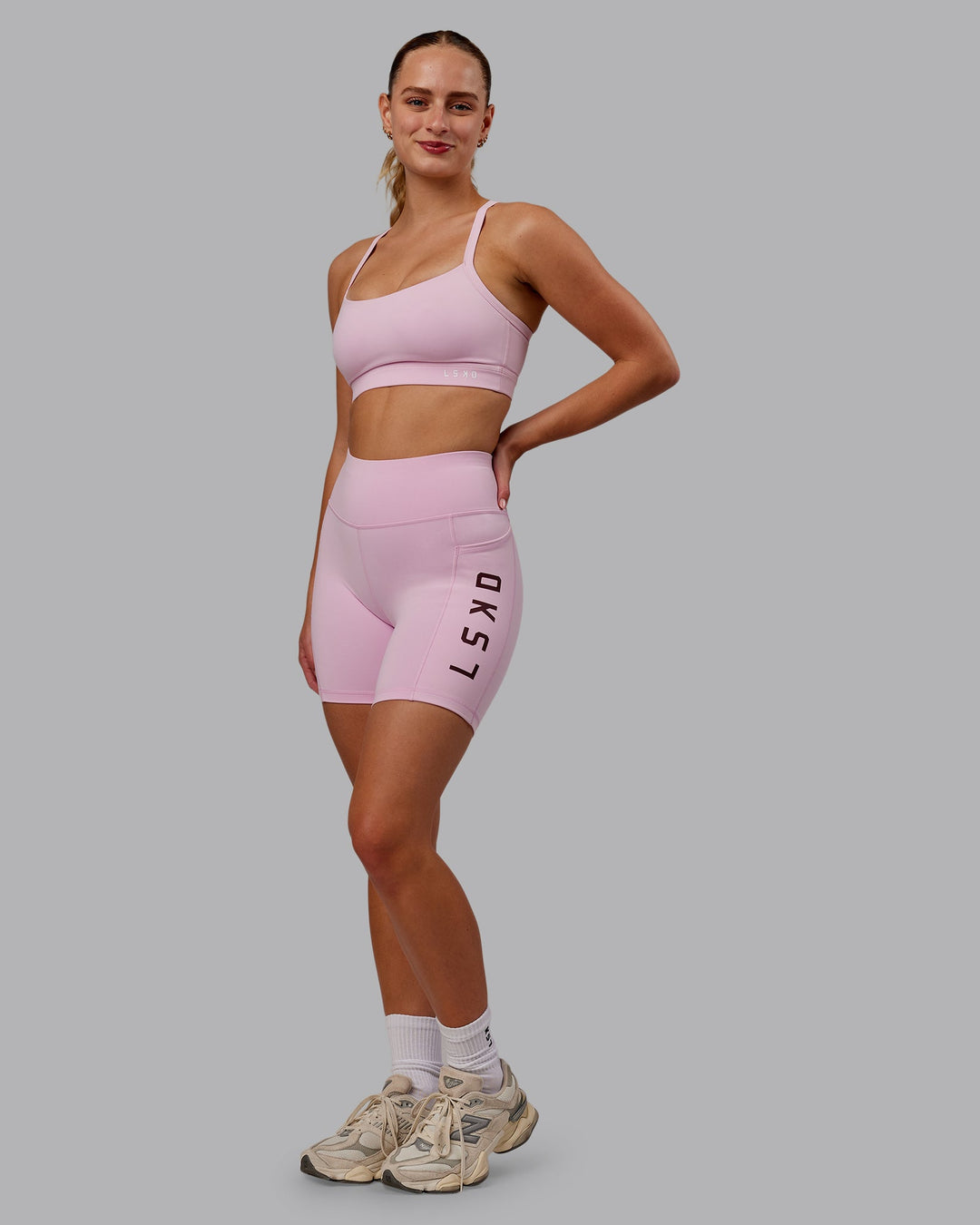 Woman wearing Rep Ultra High-Rise 6" Short Pockets - Marshmallow-Cherry Lacquer