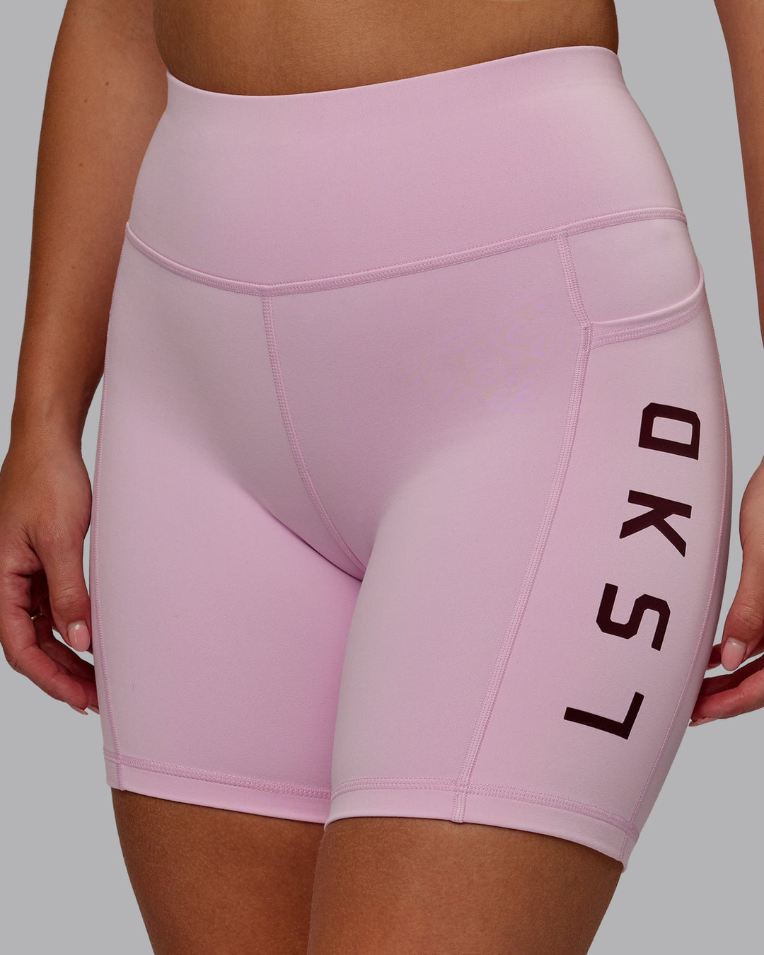 Woman wearing Rep Ultra High-Rise 6" Short Pockets - Marshmallow-Cherry Lacquer