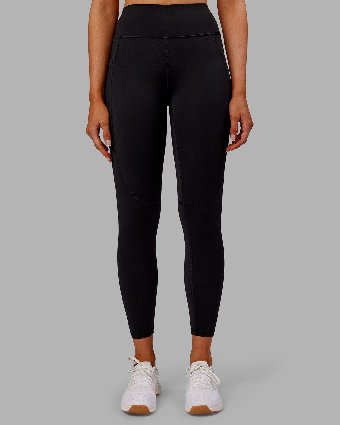 Woman wearing Rep Ultra High-Rise 7/8 Legging Pockets - Black-Ultra Orange | Model:Ella | Size:S