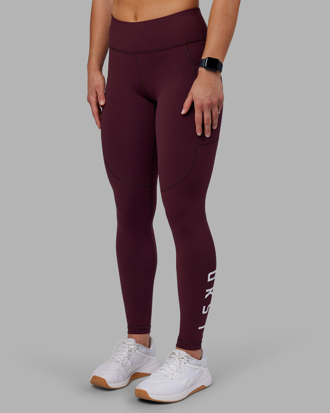 Woman wearing Rep Ultra High-Rise Full Length Legging Pockets - Cherry Lacquer-White | Model:Keisha | Size:S