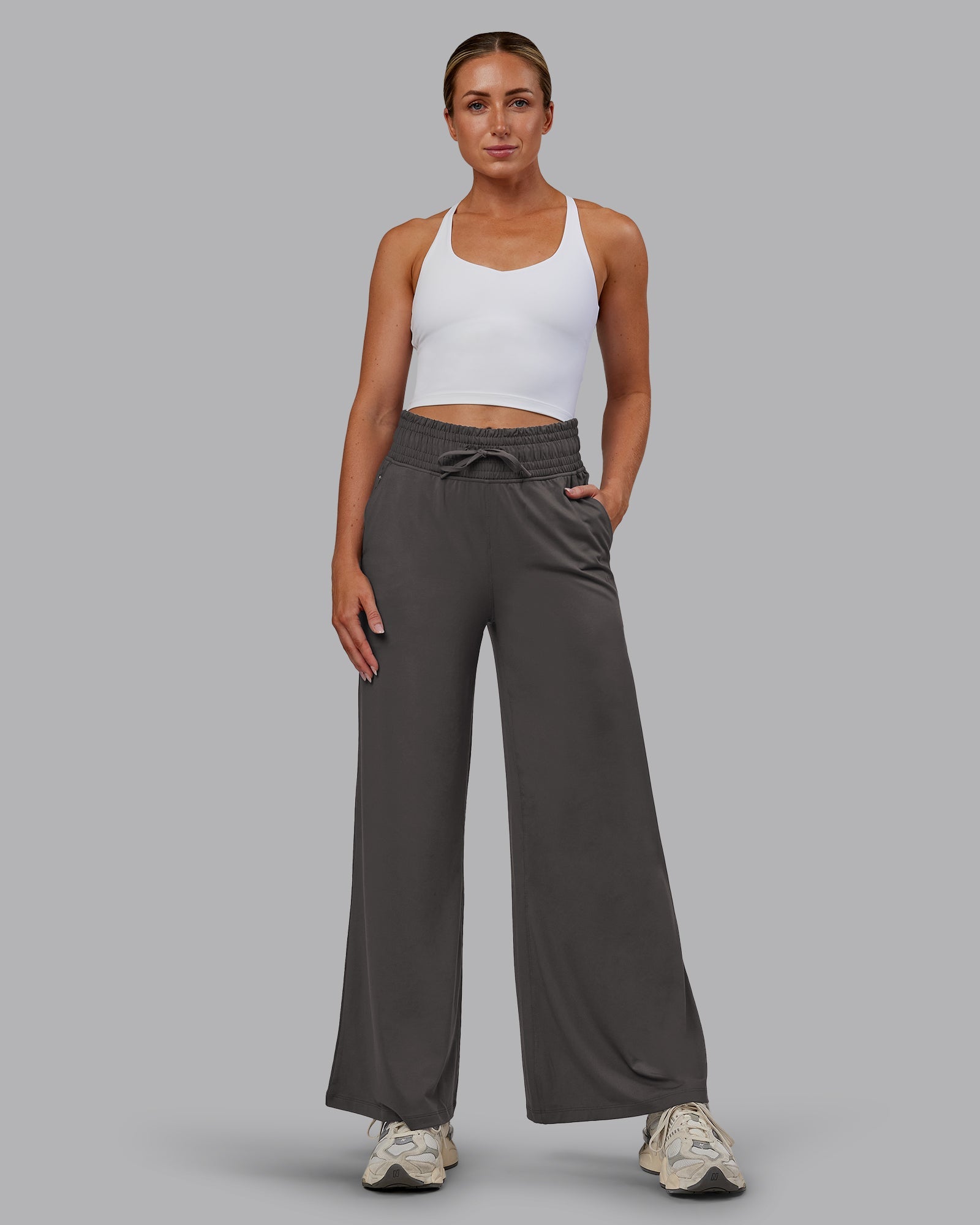Woman wearing Restore CloudFLX Wide Leg Pant - Dark Storm | Model:Paris | Size:S